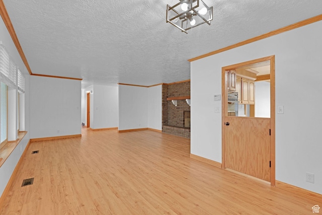8693 S Vaquero Dr, Sandy, UT 84094 - unfurnished living room featuring a brick fireplace, light wood-style floors, visible vents, and ornamental molding