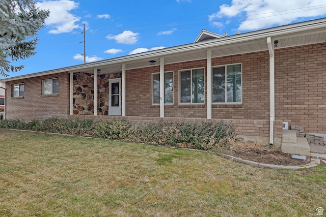 8693 S Vaquero Dr, Sandy, UT 84094 - ranch-style house with brick siding, covered porch, and a front yard