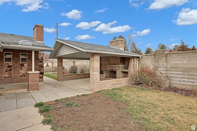 8693 S Vaquero Dr, Sandy, UT 84094 - exterior space with a brick fireplace and fence
