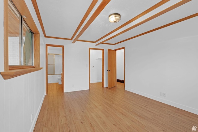 8693 S Vaquero Dr, Sandy, UT 84094 - unfurnished room with beamed ceiling, light wood-style flooring, and baseboards