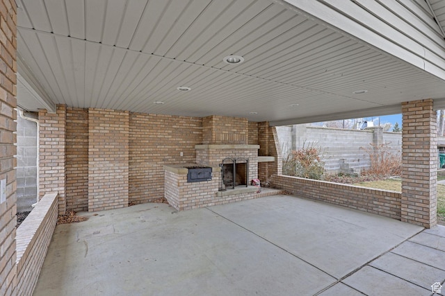 8693 S Vaquero Dr, Sandy, UT 84094 - view of patio / terrace featuring an outdoor brick fireplace