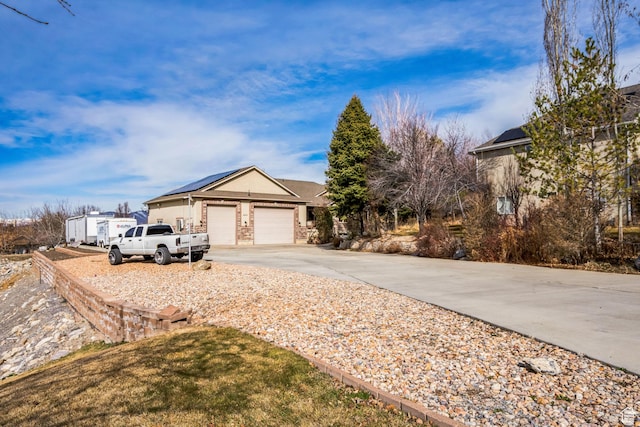 ranch-style home with driveway and an attached garage