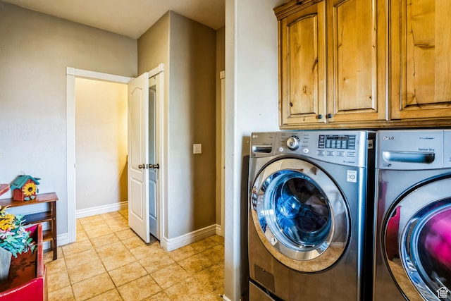 9575 Aztec Dr, Cedar Hills, UT 84062 - laundry room with light tile patterned floors, baseboards, cabinet space, and washer and dryer