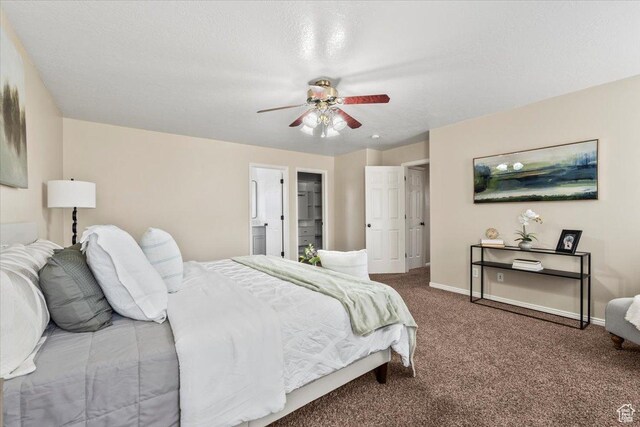 2419 N Nectar Way, Saratoga Springs, UT 84045 - carpeted bedroom featuring baseboards, a ceiling fan, and ensuite bath