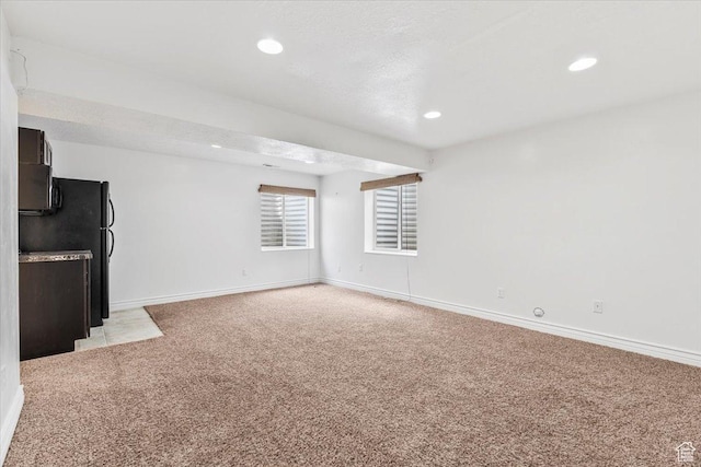 2419 N Nectar Way, Saratoga Springs, UT 84045 - unfurnished living room featuring light colored carpet, baseboards, and recessed lighting