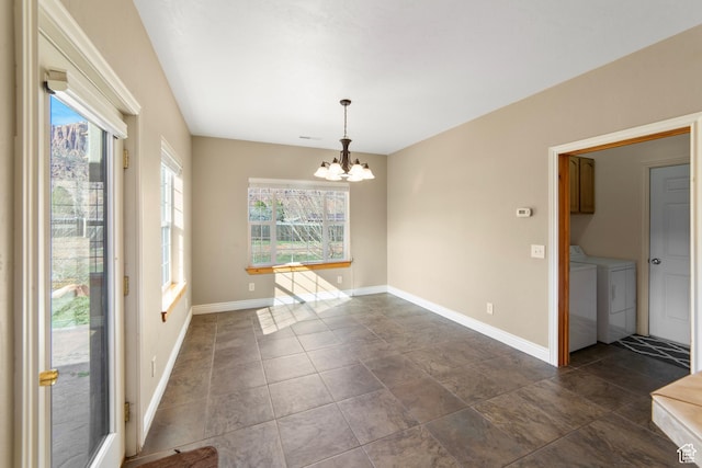 4224 Valle Del Sol, Moab, UT 84532 - unfurnished dining area with baseboards, a notable chandelier, and independent washer and dryer