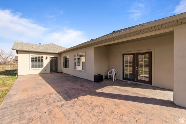 4224 Valle Del Sol, Moab, UT 84532 - back of house with french doors, a patio area, fence, and stucco siding