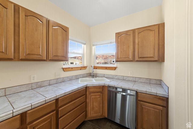 4224 Valle Del Sol, Moab, UT 84532 - kitchen with dishwasher, a sink, and brown cabinets