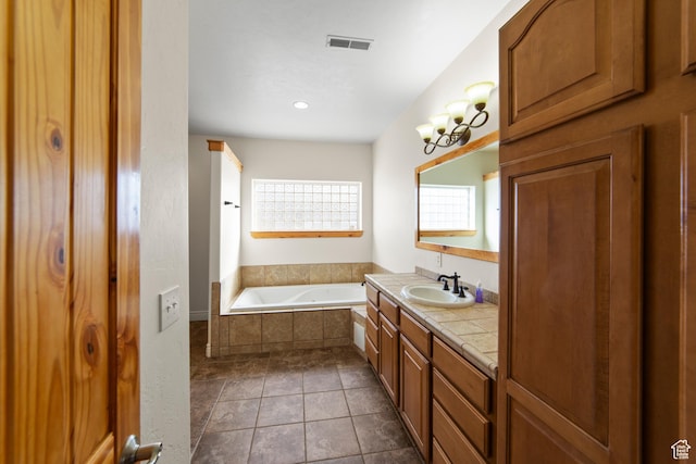 4224 Valle Del Sol, Moab, UT 84532 - bathroom with tile patterned flooring, vanity, visible vents, a bath, and an inviting chandelier