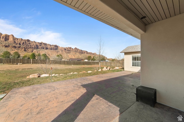 4224 Valle Del Sol, Moab, UT 84532 - view of yard featuring a patio area, a mountain view, and a fenced backyard