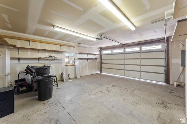4224 Valle Del Sol, Moab, UT 84532 - garage with electric panel and a garage door opener