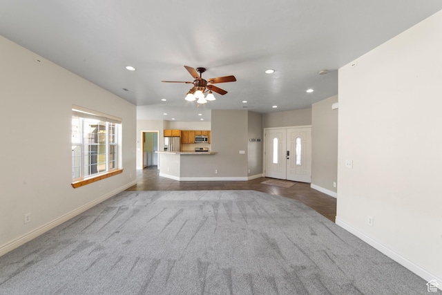 4224 Valle Del Sol, Moab, UT 84532 - unfurnished living room featuring recessed lighting, ceiling fan, baseboards, and dark colored carpet