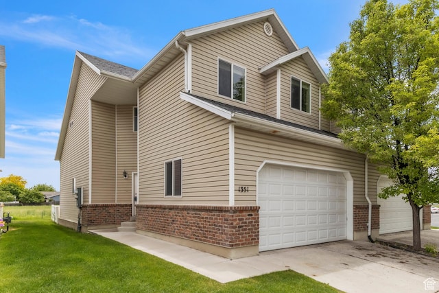 1351 Westbridge Cir, Provo, UT 84601 - view of home's exterior with brick siding, a garage, a lawn, and driveway