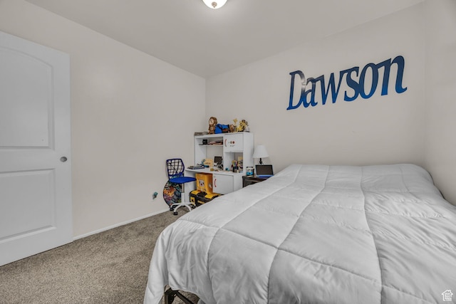 carpeted bedroom featuring baseboards