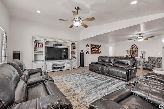 living room featuring lofted ceiling, recessed lighting, baseboards, and ceiling fan