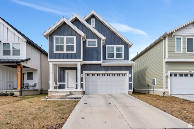 437 S Burr Oak Ln W, Saratoga Springs, UT 84045 - view of front of house with board and batten siding, driveway, and a garage