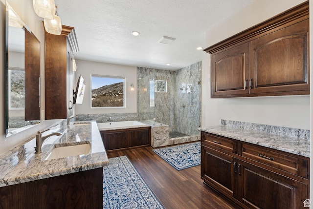 11680 E 29130 N, Fairview, UT 84629 - bathroom featuring a shower stall, two vanities, a garden tub, wood finished floors, and recessed lighting