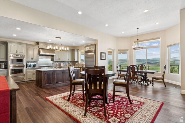 11680 E 29130 N, Fairview, UT 84629 - dining room featuring a chandelier, recessed lighting, dark wood-style flooring, and baseboards