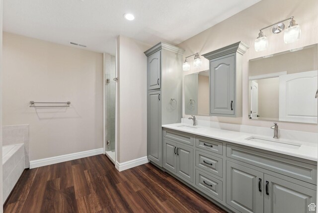 11680 E 29130 N, Fairview, UT 84629 - full bathroom featuring double vanity, wood finished floors, a stall shower, baseboards, and tiled bath