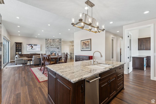11680 E 29130 N, Fairview, UT 84629 - kitchen with a sink, dark wood-style floors, a fireplace, an island with sink, and pendant lighting