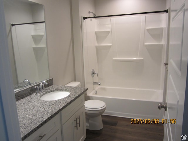 bathroom with shower / tub combination, toilet, vanity, and wood finished floors