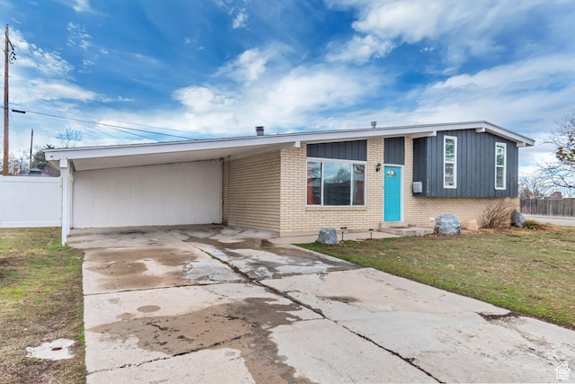 3734 S Bannock St, West Valley City, UT 84120 - view of front of property featuring entry steps, brick siding, fence, and an attached carport