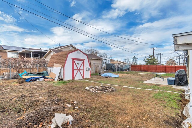 3734 S Bannock St, West Valley City, UT 84120 - view of yard featuring an outbuilding, fence, a patio, and a shed