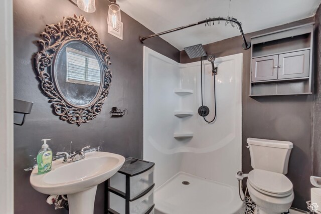 3734 S Bannock St, West Valley City, UT 84120 - bathroom with a shower, a sink, and toilet