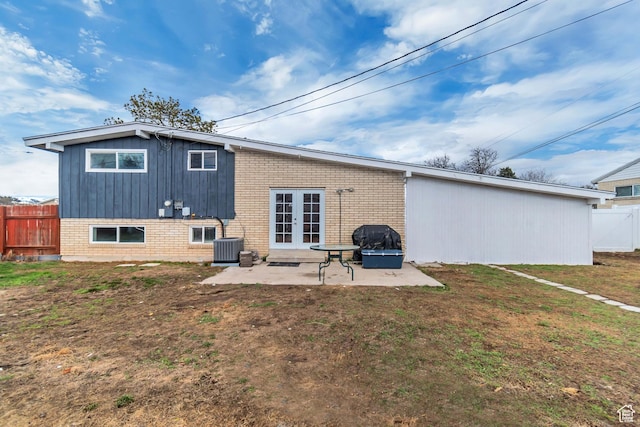 3734 S Bannock St, West Valley City, UT 84120 - back of house featuring french doors, a patio area, fence, and brick siding