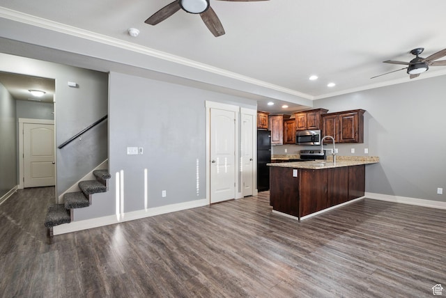 2887 N 1175 W, Layton, UT 84041 - kitchen with baseboards, dark wood finished floors, appliances with stainless steel finishes, a peninsula, and crown molding