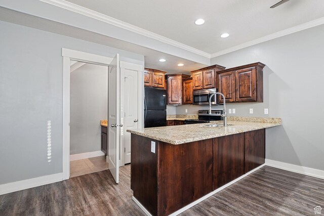 2887 N 1175 W, Layton, UT 84041 - kitchen with a peninsula, dark wood-type flooring, baseboards, appliances with stainless steel finishes, and crown molding