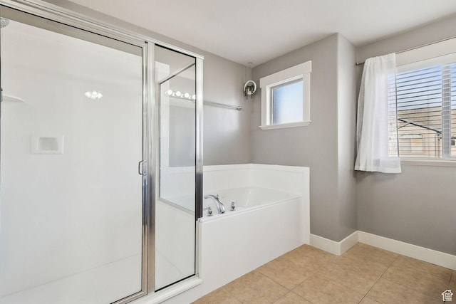 2887 N 1175 W, Layton, UT 84041 - full bathroom featuring a garden tub, a shower stall, baseboards, and tile patterned floors
