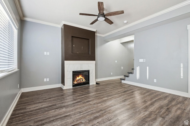 2887 N 1175 W, Layton, UT 84041 - unfurnished living room featuring crown molding, a ceiling fan, wood finished floors, a tile fireplace, and baseboards
