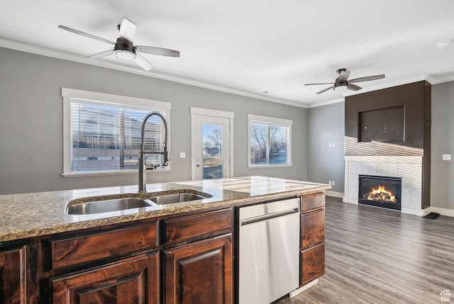 2887 N 1175 W, Layton, UT 84041 - kitchen featuring crown molding, a sink, and a tiled fireplace