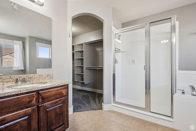 2887 N 1175 W, Layton, UT 84041 - full bathroom with a shower stall, vanity, a walk in closet, and tile patterned floors