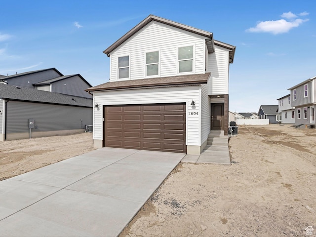 1604 E Pheasant Rd Unit 208, Eagle Mountain, UT 84005 - traditional-style house featuring a garage and concrete driveway