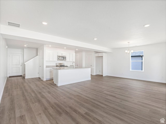 1604 E Pheasant Rd Unit 208, Eagle Mountain, UT 84005 - unfurnished living room featuring recessed lighting, visible vents, and light wood-style flooring
