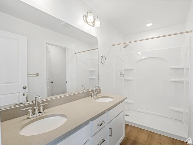 1604 E Pheasant Rd Unit 208, Eagle Mountain, UT 84005 - full bathroom with a sink, walk in shower, and wood finished floors
