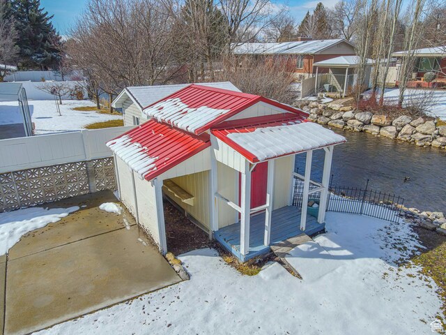 1045 Fox Farm Rd, Logan, UT 84321 - snow covered structure with fence and an outbuilding