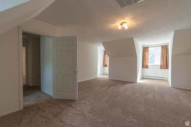 1045 Fox Farm Rd, Logan, UT 84321 - bonus room with lofted ceiling, a baseboard radiator, a baseboard heating unit, carpet flooring, and visible vents