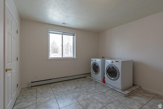 1045 Fox Farm Rd, Logan, UT 84321 - washroom featuring a textured ceiling, a baseboard radiator, laundry area, visible vents, and independent washer and dryer