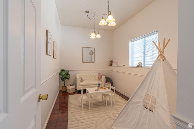 1045 Fox Farm Rd, Logan, UT 84321 - interior space with baseboards, a chandelier, and wood finished floors
