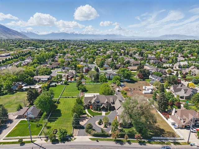aerial view of residential area featuring a mountain backdrop