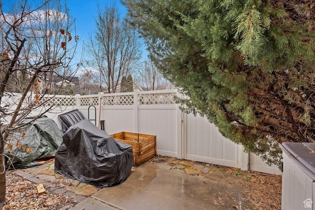 view of patio / terrace featuring a grill and fence