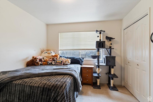 bedroom featuring a closet, carpet flooring, and baseboards