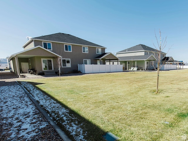 926 N 165 W, Nephi, UT 84648 - back of house featuring a patio, a lawn, fence, and stucco siding