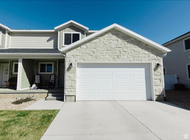 926 N 165 W, Nephi, UT 84648 - view of front of property with stone siding, concrete driveway, board and batten siding, and an attached garage