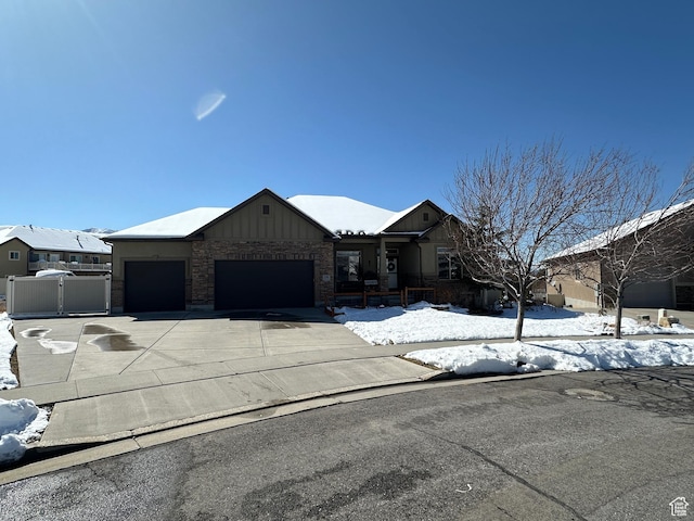 338 S 1230 E, Tooele, UT 84074 - view of front facade featuring an attached garage, concrete driveway, fence, and a gate