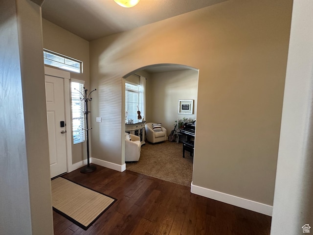 338 S 1230 E, Tooele, UT 84074 - foyer entrance with arched walkways, dark wood-style flooring, and baseboards
