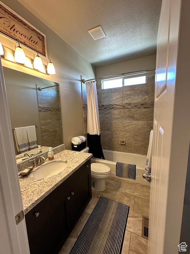 338 S 1230 E, Tooele, UT 84074 - full bathroom with vanity, a textured ceiling, toilet, visible vents, and shower / bath combo with shower curtain